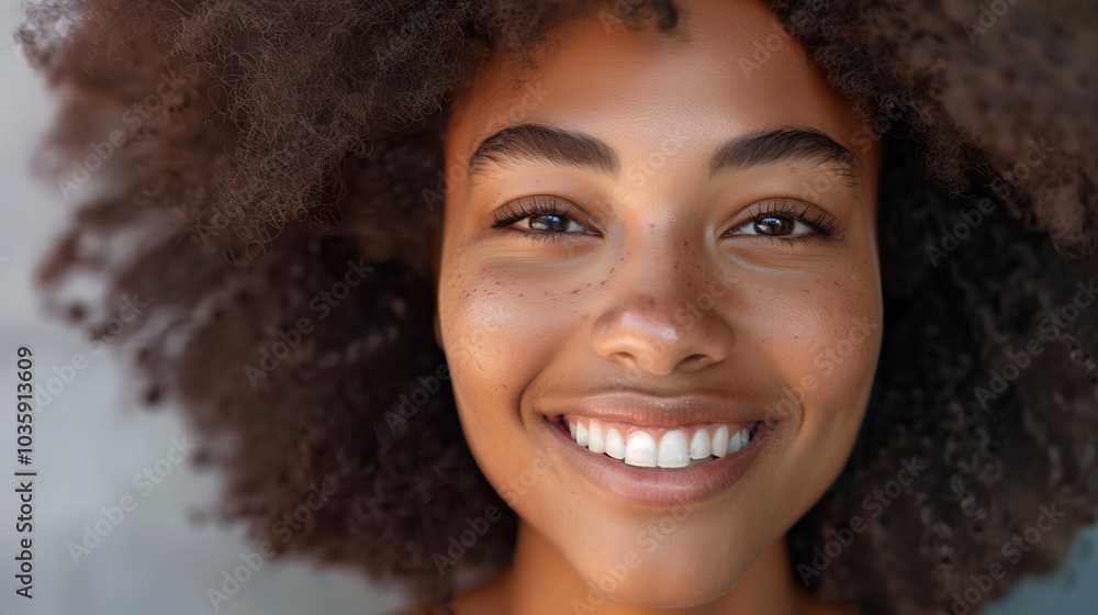 Smiling Woman with Curly Hair: A Portrait of Natural Beauty and Happiness Smiling Woman with Curly Hair: A Portrait of Natural Beauty and Happiness