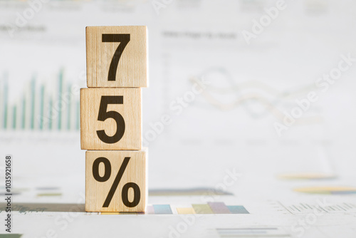 75 Percent a word written on wooden cubes on a white background.