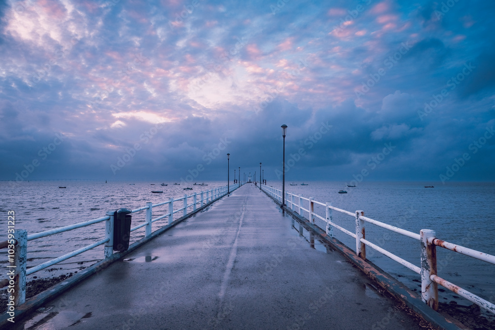 Jetty in a stormy day. Pier in the Alcochete village in Portuga Jetty in a stormy day. Pier in the Alcochete village in Portuga