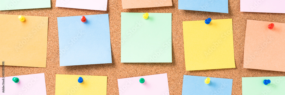 Cork board with colorful blank notes