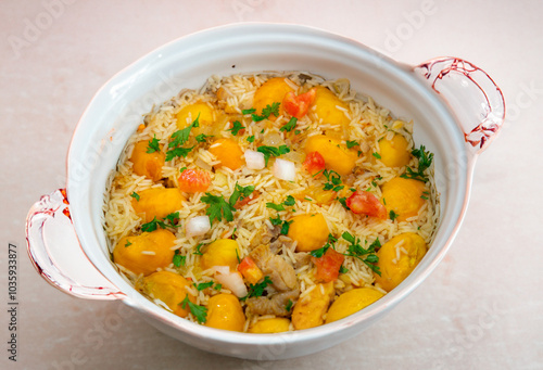 Traditional Brazilian dish rice, chicken and pequi (caryocar brasileinse) known as galinhada goiana