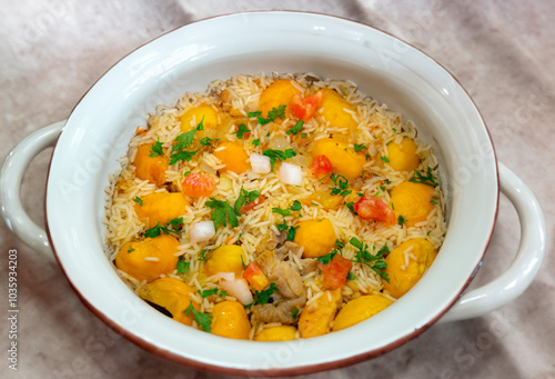 Traditional Brazilian dish rice, chicken and pequi (caryocar brasileinse) known as galinhada goiana