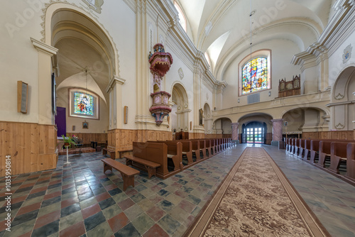 BORUNY, BELARUS - SEPTEMBER 12, 2024: interior of old catholic church with columns and frescoes photo