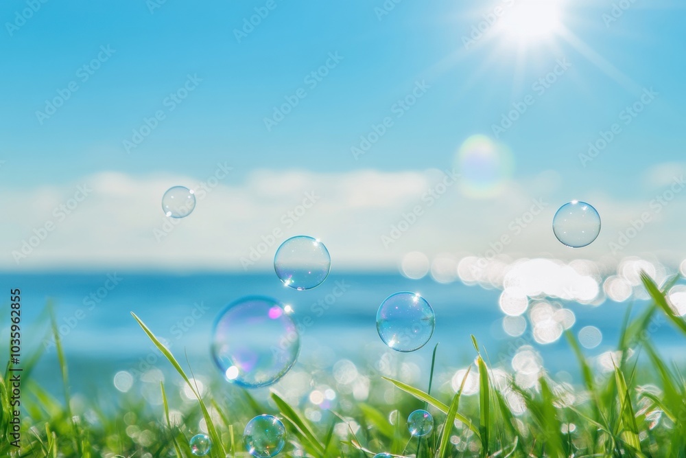 Tranquil beachfront with lush grass under a bright blue horizon and sunlight glimmering on drifting soap bubbles. Vertical summer landscape Tranquil beachfront with lush grass under a bright blue horizon and sunlight glimmering on drifting soap bubbles. Vertical summer landscape