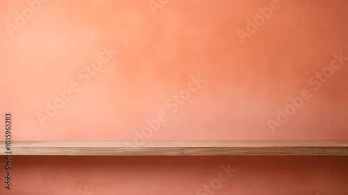 A wooden shelf sits against a vibrant coral wall. Peach fuzz color