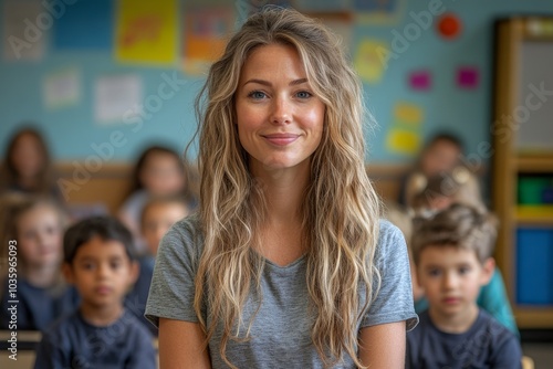 Portrait of smiling female teacher in a class at school.