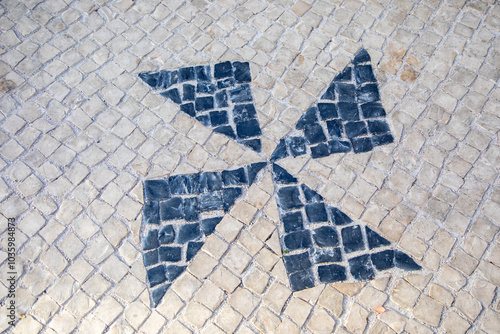 Mosaic Paving Tiles in Aveiro, Portugal. Traditional Portuguese paving slabs. Basalt and limestone stones of black and white colors are traditionally used for patterns
