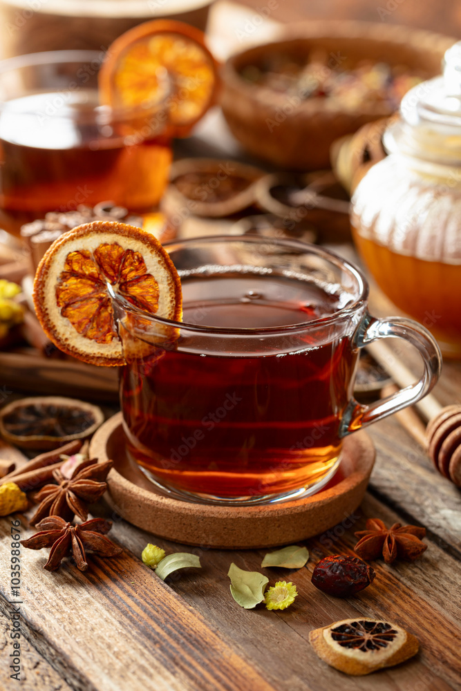 Herbal tea with cinnamon, anise, dried herbs, and dry citrus slices. Herbal tea with cinnamon, anise, dried herbs, and dry citrus slices.