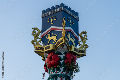 Bandaraya Kuching Selatan (Kuching South City Council) Emblem, Coat of Arms monument Sculpture with Cat, Scales of Justice, Golf Leaf and Rafflesia Arnoldii (World's Biggest Flower). photo