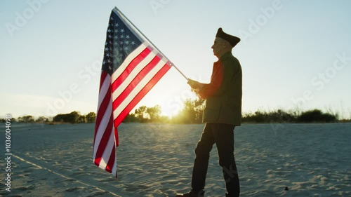 Old Veteran walking in the beach alt sunset with Usa Flag 