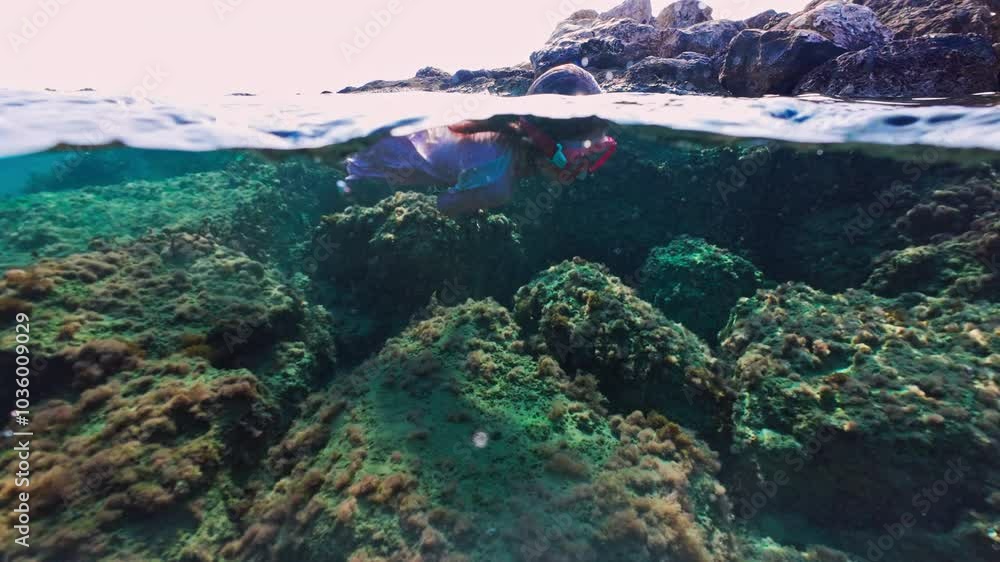 Young Girl in Goggles Swims and Dives Underwater - Kid's Fun Snorkeling Experience in the Sea. High quality 4k footage Young Girl in Goggles Swims and Dives Underwater - Kid's Fun Snorkeling Experience in the Sea. High quality 4k footage