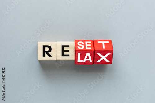 Reset symbol. Rotating wooden cubes changes the word 