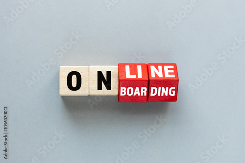 Online onboarding symbol. Rotated wooden cubes form the word 