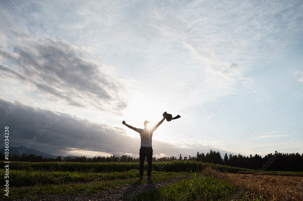Embracing the horizon A moment of triumph in nature's light Embracing the horizon A moment of triumph in nature's light