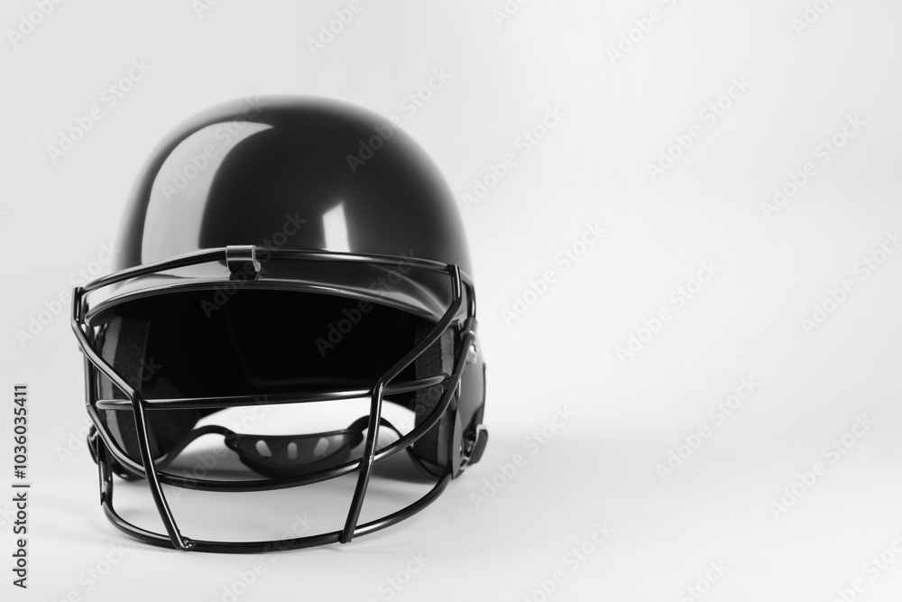 Fototapeta premium One black baseball helmet on white background, space for text