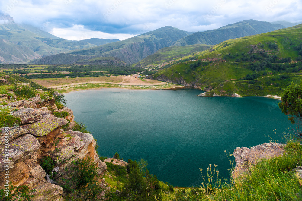 Picturesque view of the mountain lake Gizhgit with azure water. Caucasus Picturesque view of the mountain lake Gizhgit with azure water. Caucasus