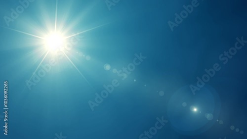 The sun is shining brightly with glare on a blue background. Abstract animation of the sunny sky.