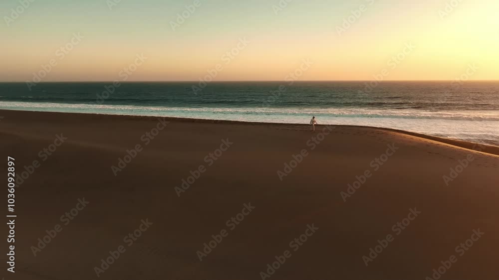 Travel, desert and silhouette of man at sunset with drone for destination, freedom or summer trip. Footprints, adventure and journey with guy on horizon of sand dunes on trip of Africa vacation Travel, desert and silhouette of man at sunset with drone for destination, freedom or summer trip. Footprints, adventure and journey with guy on horizon of sand dunes on trip of Africa vacation