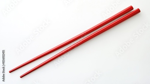 Red chopsticks isolated on white symbolizing the essence of Asian dining culture photo