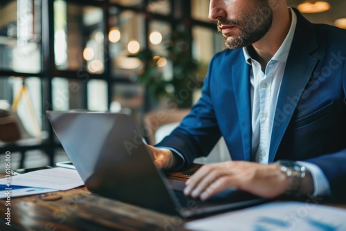 Office employee in a formal setting concentrating on a computer task