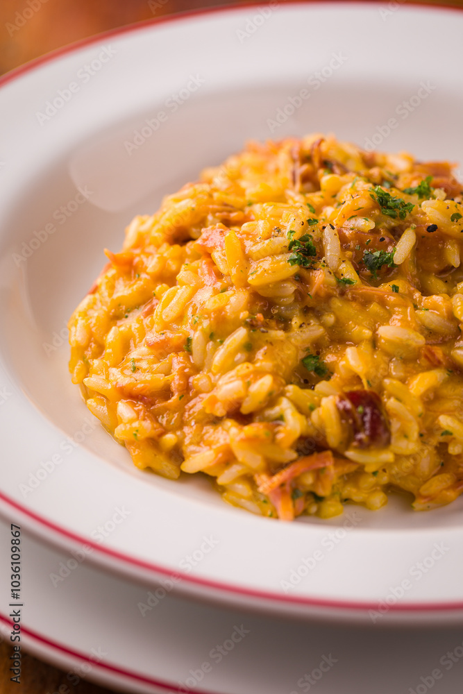 Creamy Risotto with Bacon Garnished with Fresh Herbs in White Bowl Creamy Risotto with Bacon Garnished with Fresh Herbs in White Bowl