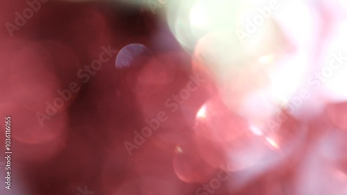 Defocused shimmering glitter lights. Sparkling highlights. Abstract holographic background	