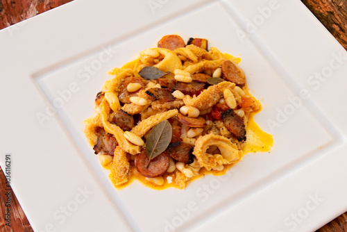 Beef tripe (bucho), beef stomach, tripe on a white plate. Dobradinha photo