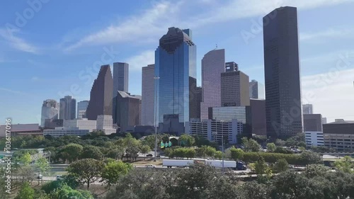 Downtown Houston Texas revealed by rising drone from west side.