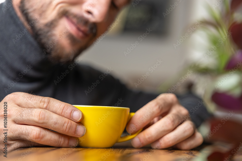 Close-up happy young man smiling in a cafe holding a cup of matcha tea, art with heart shape milk, cappuccino coffee with foam and heart, espresso coffee, decoration with plants, vegan hot drink Close-up happy young man smiling in a cafe holding a cup of matcha tea, art with heart shape milk, cappuccino coffee with foam and heart, espresso coffee, decoration with plants, vegan hot drink