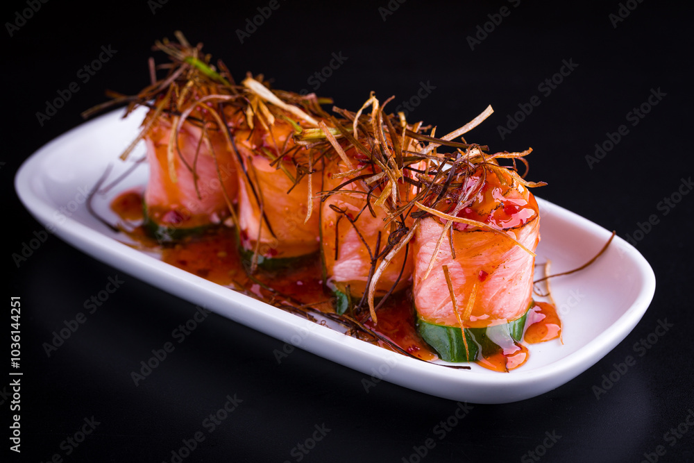 Gourmet Salmon Sashimi Rolls with Crispy Garnish and Sauce Gourmet Salmon Sashimi Rolls with Crispy Garnish and Sauce