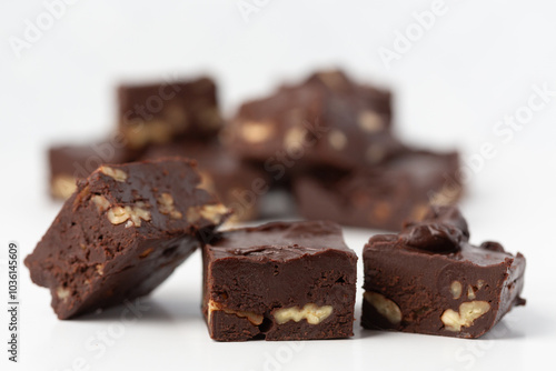 Close Up of Homemade Chocolate Pecan Fudge on a White Background