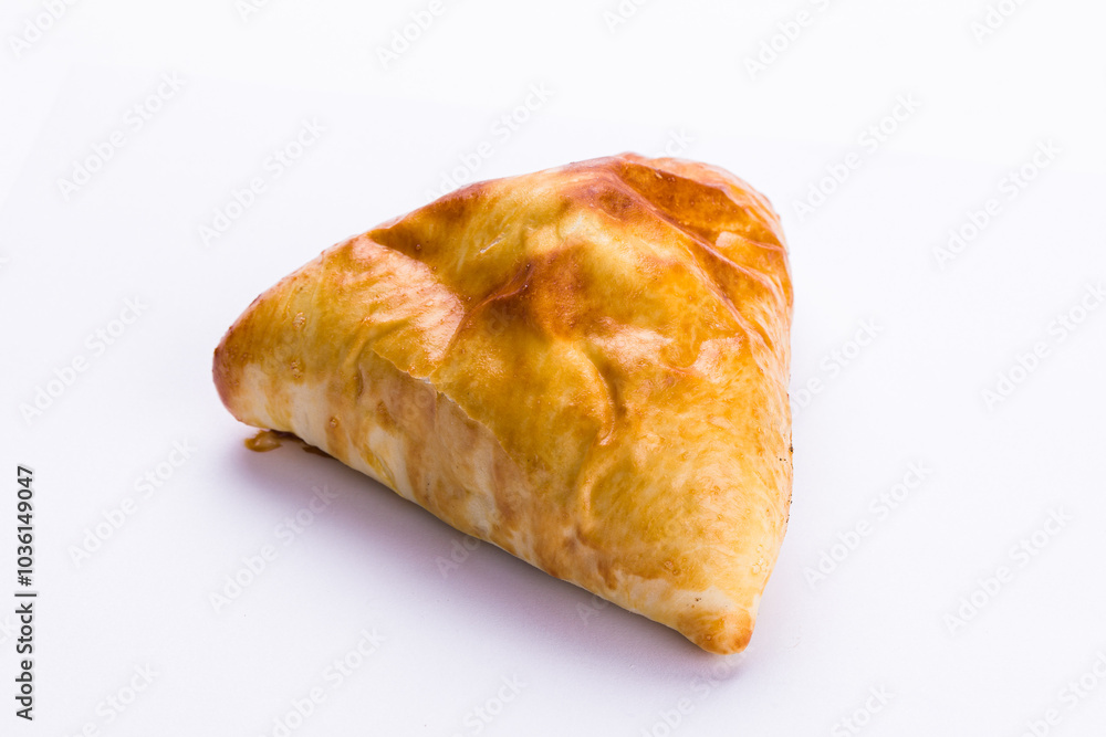 Golden Baked Pastry on Clean White Surface Golden Baked Pastry on Clean White Surface