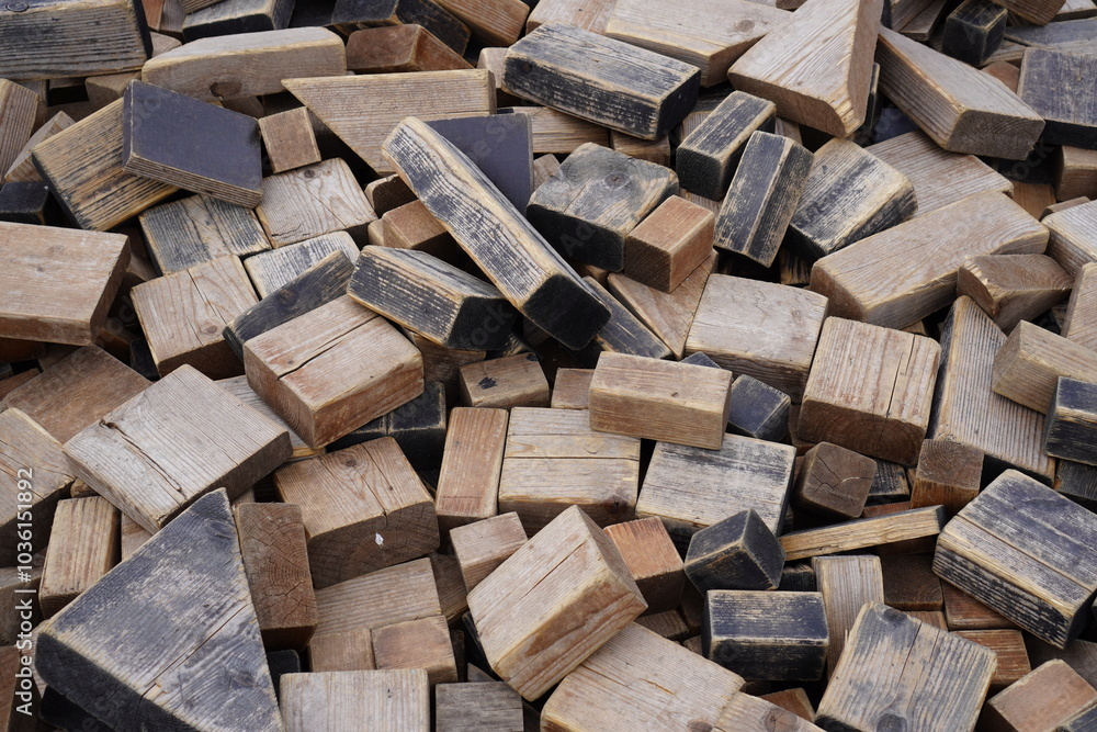 Pile of weathered wooden blocks in various shapes and sizes. Background or backdrop Pile of weathered wooden blocks in various shapes and sizes. Background or backdrop