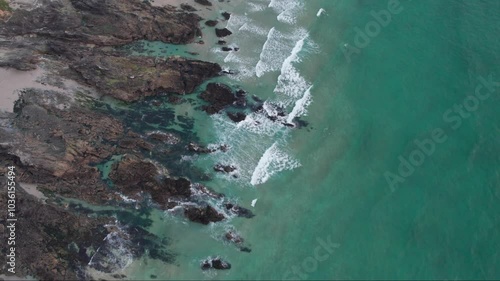 Aerial view drone of sea cost and waves. Waves crashing onto the rocks