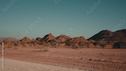 Car driving through vast Namib Naukluft National Park, Namibia