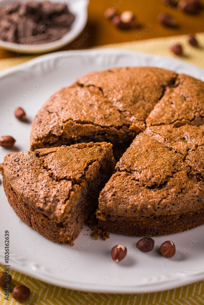 Delicious Hazelnut Cake on White Plate with Chocolate Garnish Delicious Hazelnut Cake on White Plate with Chocolate Garnish