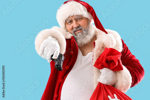 Bad Santa Claus with gun an...