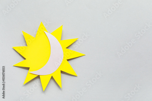 Paper sun with crescent on ...