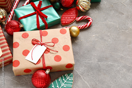 Composition with beautiful Christmas gifts and decorations on grunge background