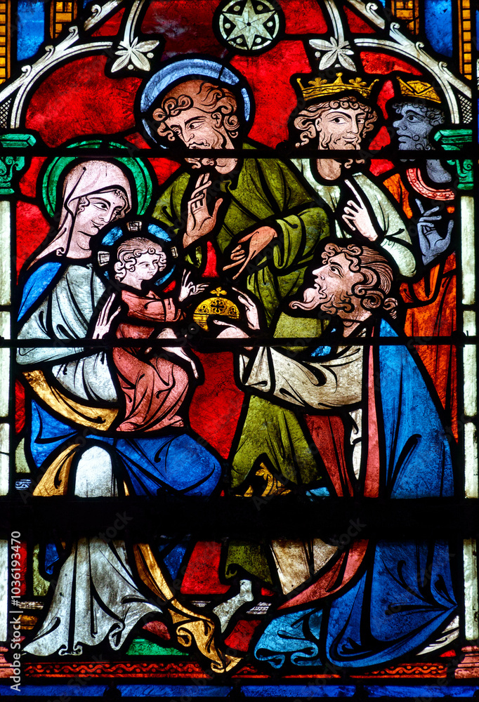 2024-10-16, Auxerre, FRANCE. Stained glass (17th century) of Christmas Nativity Scene : Adoration of the Magi as they present gifts of gold, frankincense and myrrh to the Infant Jesus. 2024-10-16, Auxerre, FRANCE. Stained glass (17th century) of Christmas Nativity Scene : Adoration of the Magi as they present gifts of gold, frankincense and myrrh to the Infant Jesus.