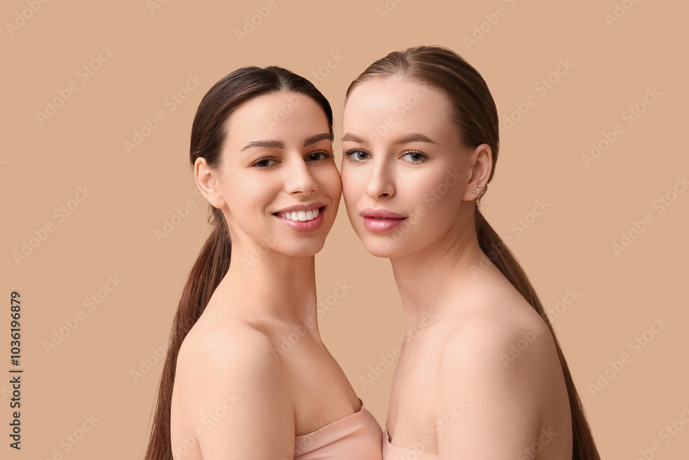 Beautiful young happy women with healthy skin on beige background Beautiful young happy women with healthy skin on beige background