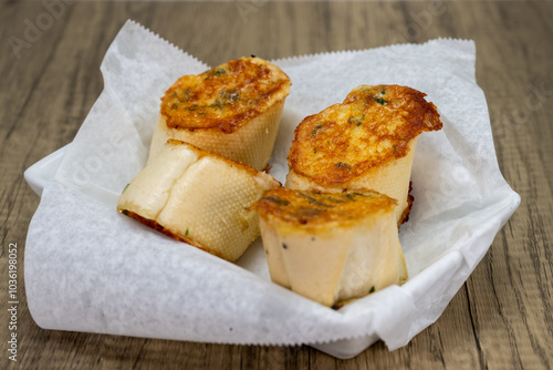 Delicious looking order of garlic bread to eat as a dinner appetizer