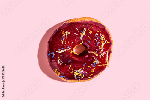 Colorful vegan donut with red fruits glazed topping photo