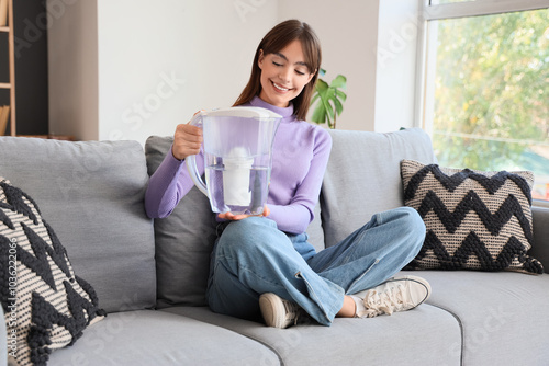Young woman holding water f...