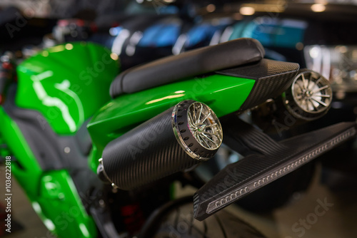 A closeup of a high performance green motorcycle showcasing exceptional design and innovation photo