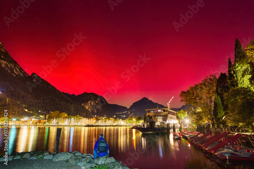 Geomagnetic storm Aurora Borealis and red SAR in Riva del Garda, Lake Garda in October 2024, Italy