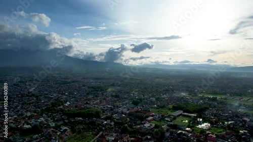 Aerial Views of A City on the Foot of Mountain in Tropical Country