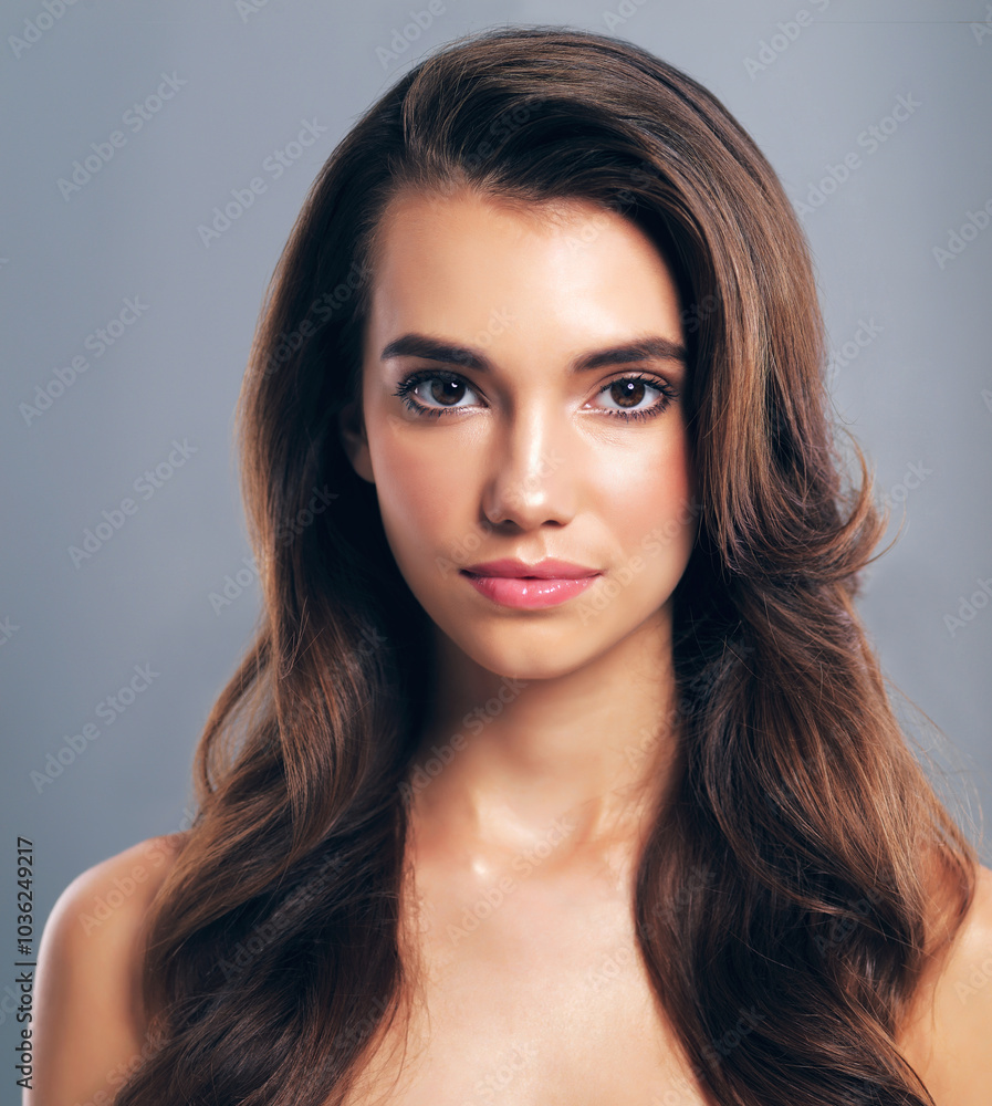 Volume, hairstyle and portrait of woman in studio for glow, beauty and hair gloss treatment. Scalp health, makeup and growth with person on gray background for haircare cosmetics, salon and keratin Volume, hairstyle and portrait of woman in studio for glow, beauty and hair gloss treatment. Scalp health, makeup and growth with person on gray background for haircare cosmetics, salon and keratin