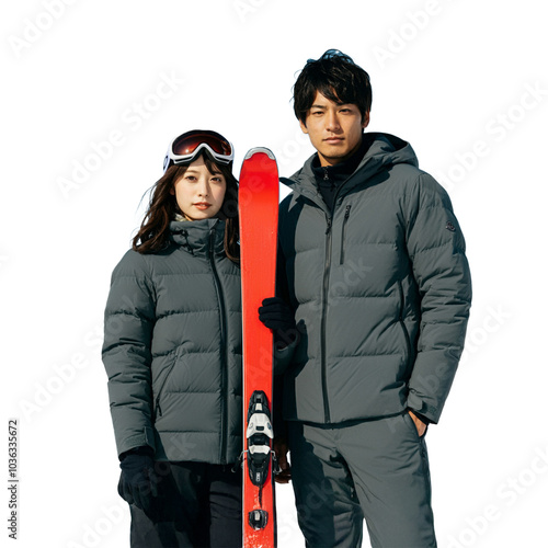 Couple in Winter Sportswear with Red Ski, Ready for Skiing Adventure