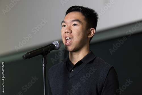 Картината върху платно A young man is giving a speech during a speaking contest